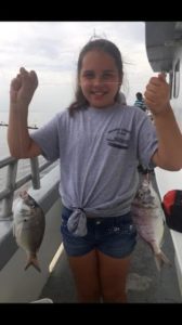 little-kid-caught-fish-on-boat